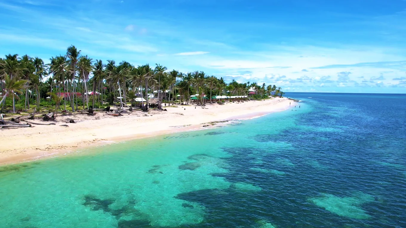Alegria Beach in Santa Monica, Siargao Island, Philippines — white sand and calm turquoise water on the northeast coast